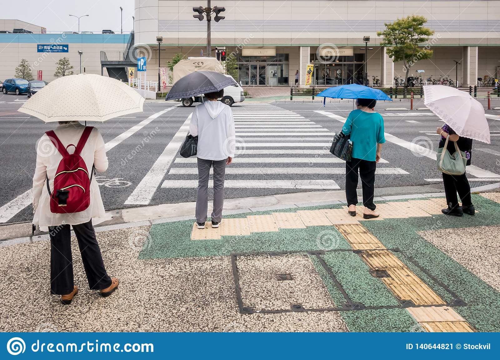 Four ladies with umbrellas